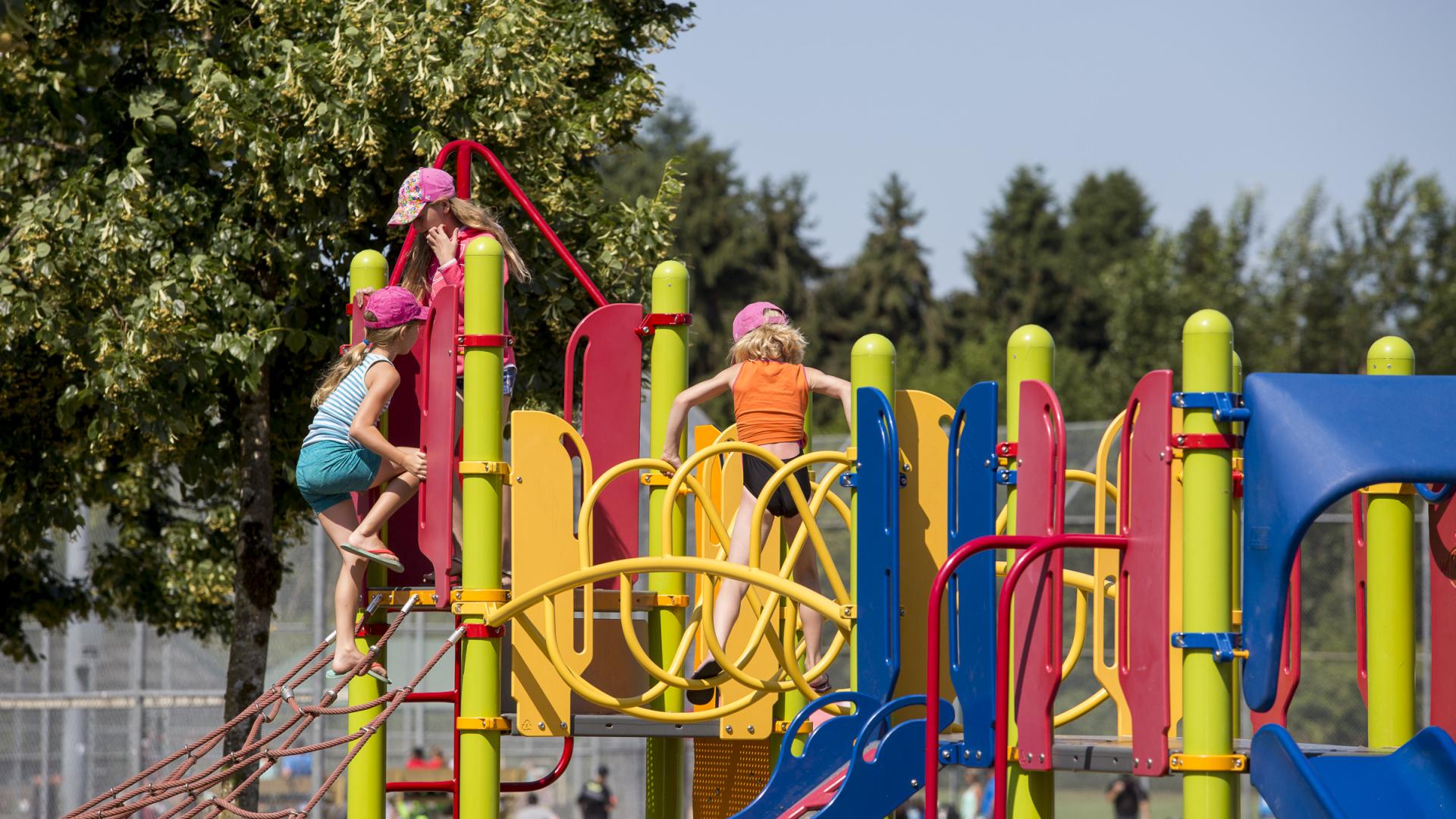 Colourful playground with kids playing